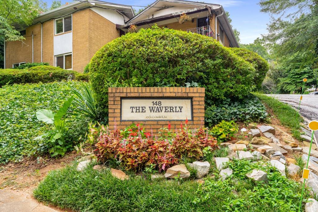 148 Waverly Way Northeast, Unit 6 Atlanta, GA 30307 - Photo 21 of 32 a sign on the side of the road