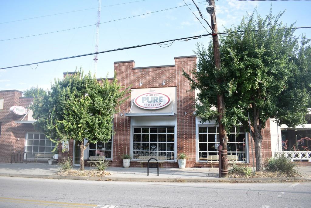 148 Waverly Way Northeast, Unit 6 Atlanta, GA 30307 - Photo 31 of 32 a view of a building with a tree front of it