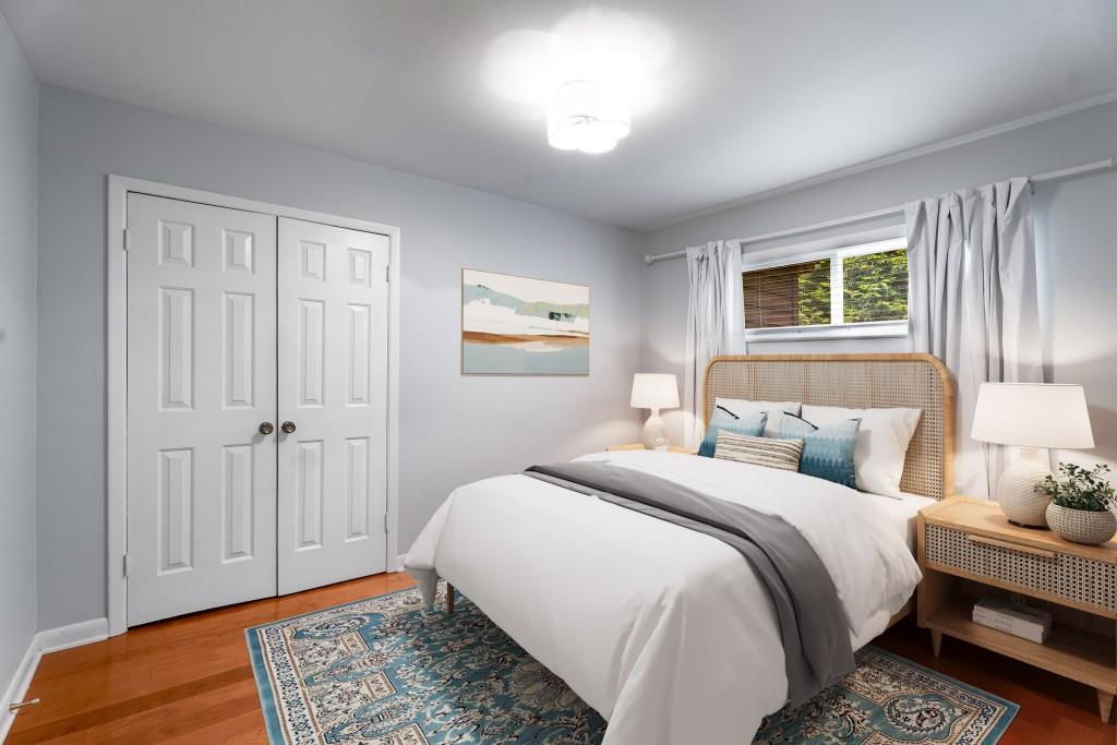 148 Waverly Way Northeast, Unit 6 Atlanta, GA 30307 - Photo 9 of 32 a bedroom with a bed and a window