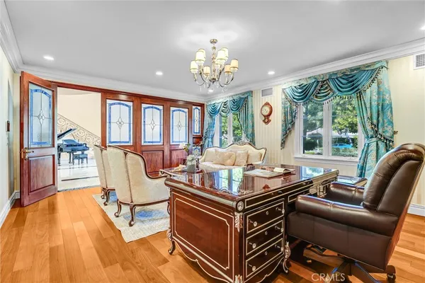 a very nice looking dining room with furniture window and wooden floor