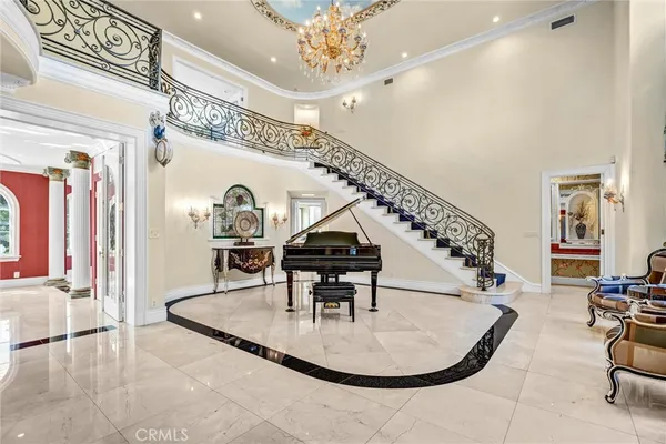 a view of entryway and dining room with stairs