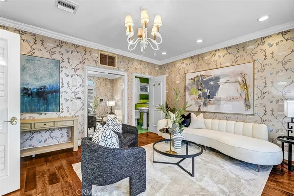 a living room with furniture and large windows