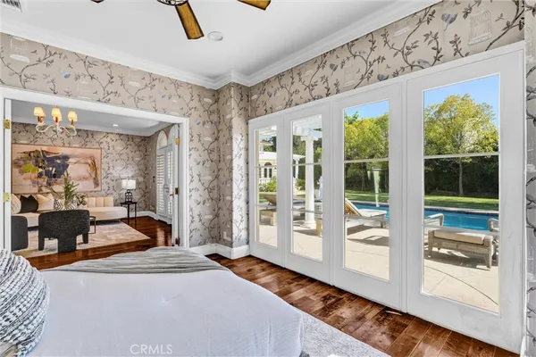 an aerial view of a house with a yard and swimming pool