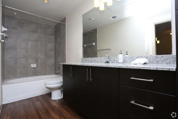a bathroom with a sink toilet and shower