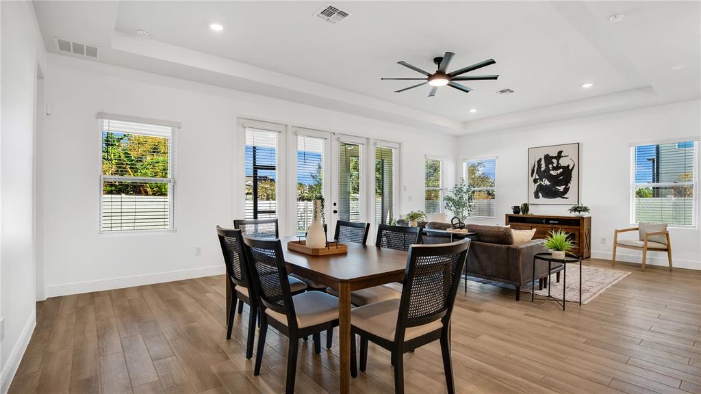 1108 Pearl Tree Road Deltona, FL 32725 - Photo 12 of 37 a view of a dining room with furniture window and wooden floor