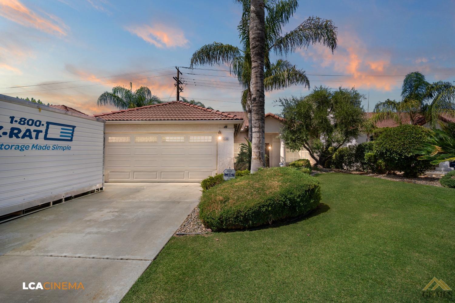 Undisclosed Address Bakersfield, CA 93311 - Photo 1 of 1 a front view of a house with a garden