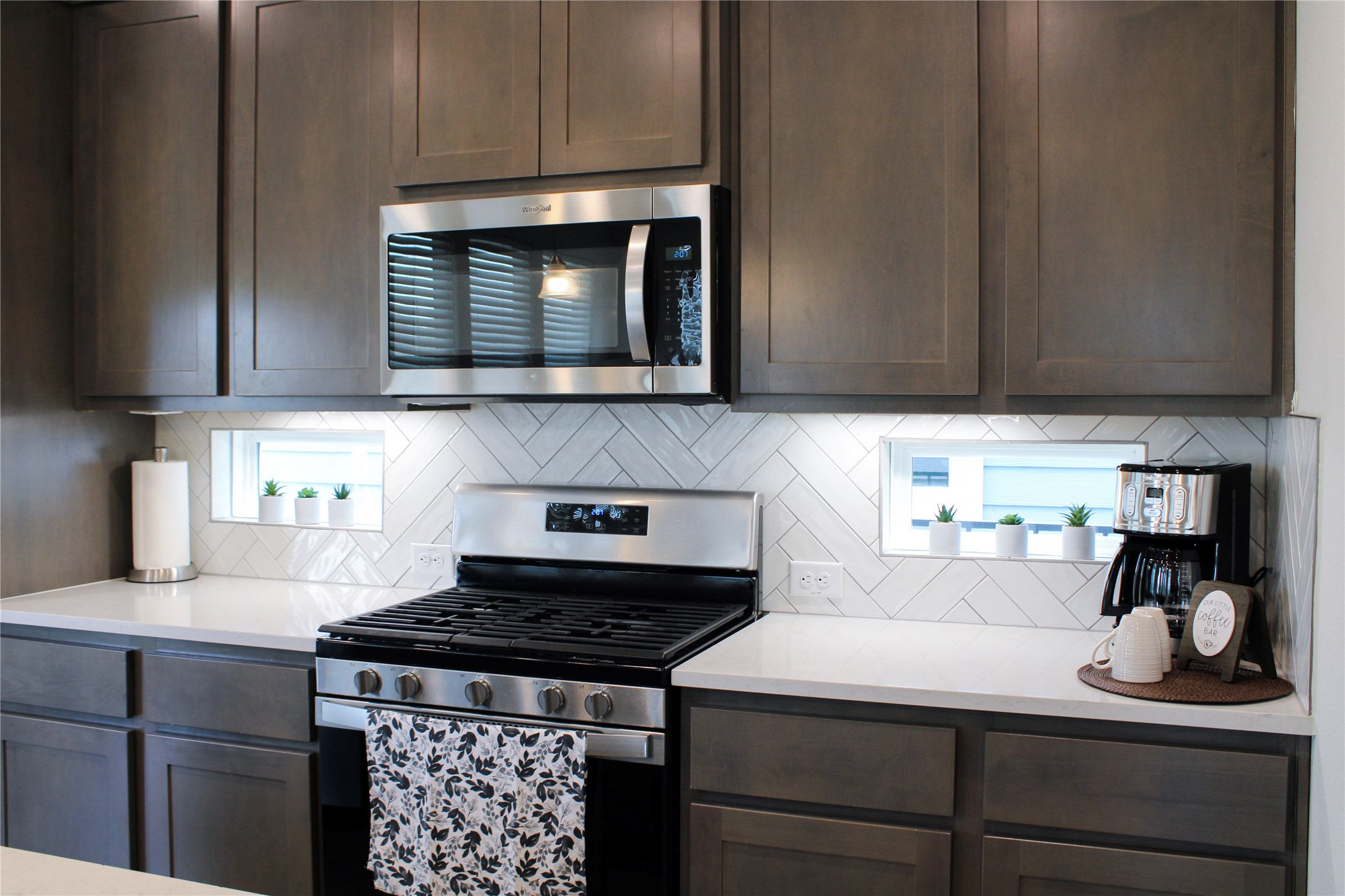 1007 Harwell Loop Kyle, TX 78640 - Photo 14 of 40 a kitchen with a stove and a microwave
