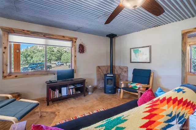 a workspace with furniture and a book shelf