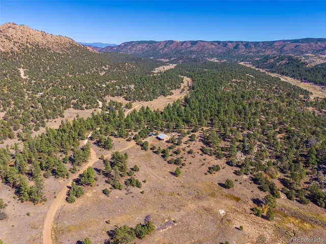 a view of a city with mountains in the background