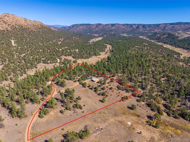 a view of a city with mountains in the background