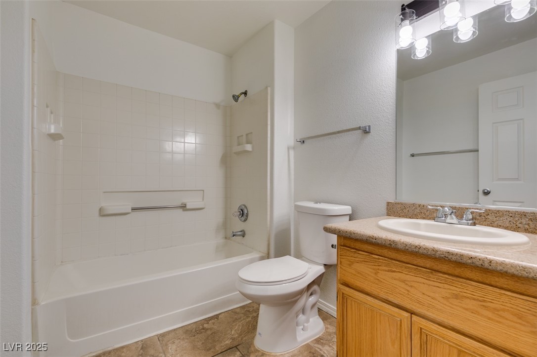3318 North Decatur Boulevard, Unit 2138 Las Vegas, NV 89130 - Photo 29 of 40 Full bathroom featuring vanity, shower / washtub combination, and toilet