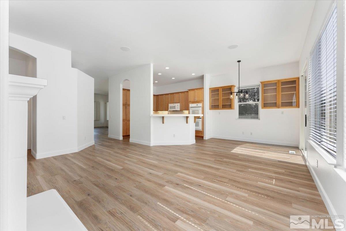1730 Hunter Creek Road Reno, NV 89519 - Photo 11 of 39 a view of a kitchen with a sink and dishwasher with wooden floor