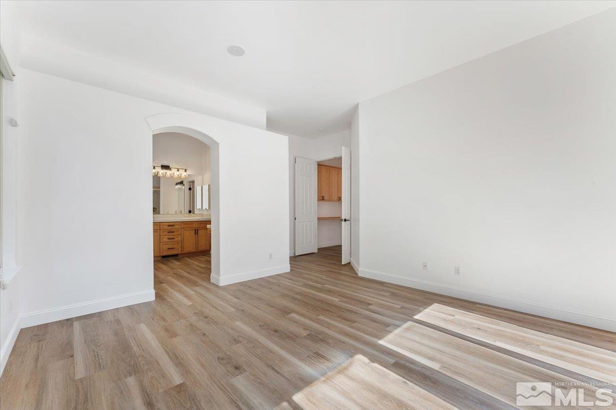 1730 Hunter Creek Road Reno, NV 89519 - Photo 18 of 39 a view of a room with wooden floor and a bathroom