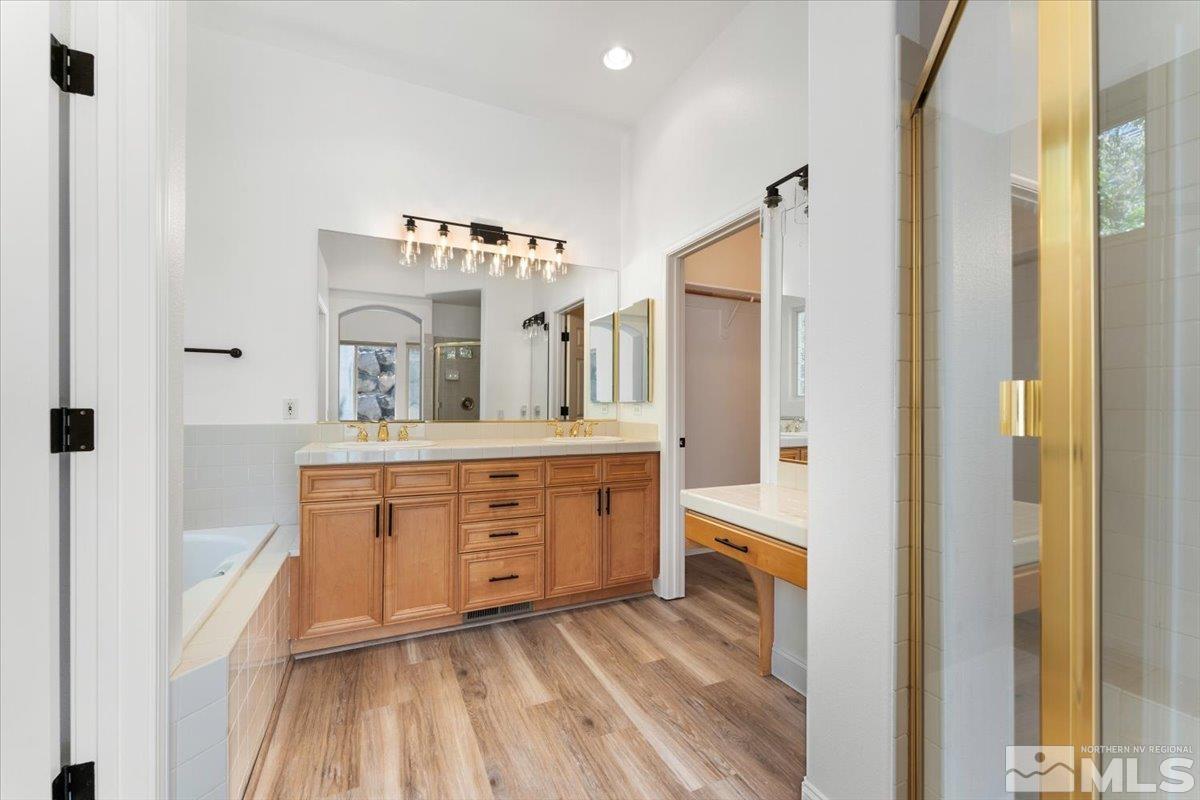 1730 Hunter Creek Road Reno, NV 89519 - Photo 19 of 39 a spacious bathroom with a double vanity sink and a mirror
