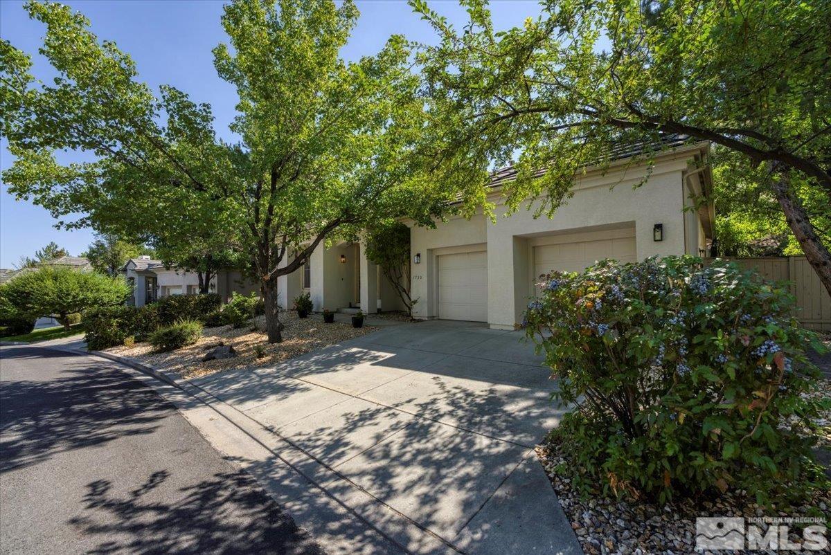 1730 Hunter Creek Road Reno, NV 89519 - Photo 2 of 39 a view of a backyard with a tree