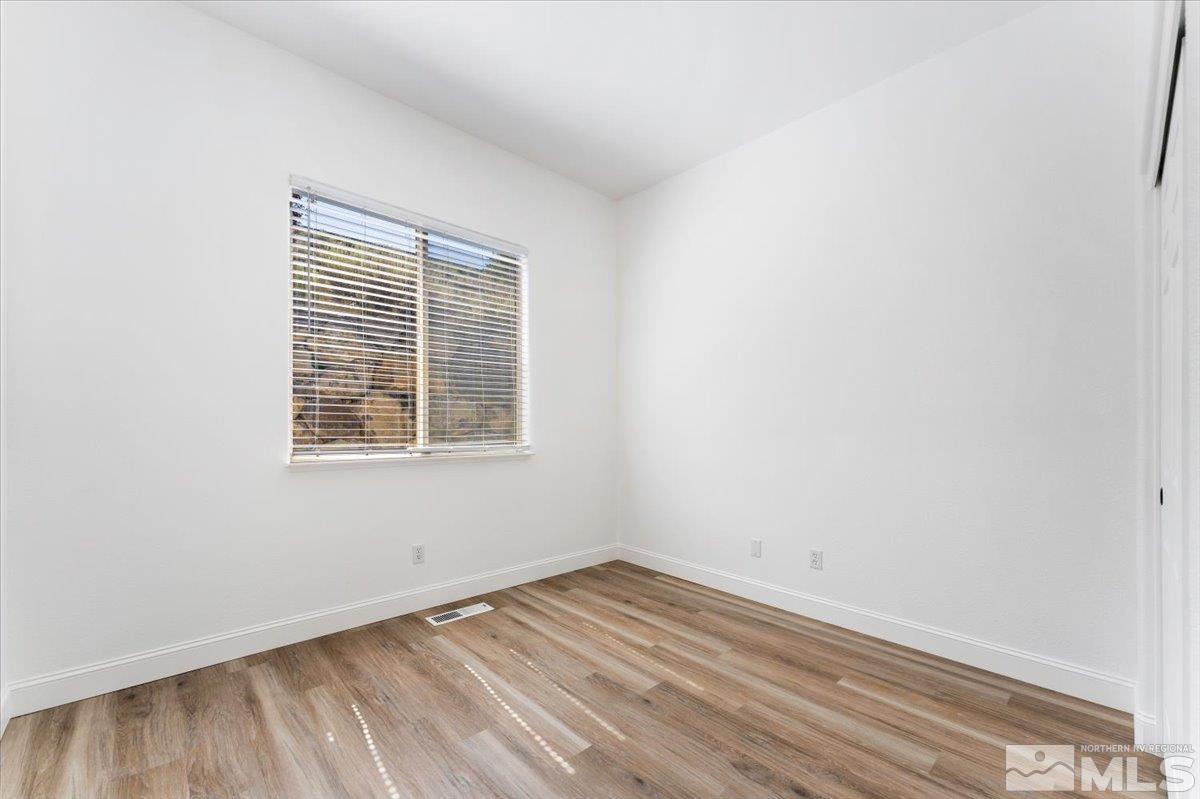 1730 Hunter Creek Road Reno, NV 89519 - Photo 21 of 39 an empty room with a window