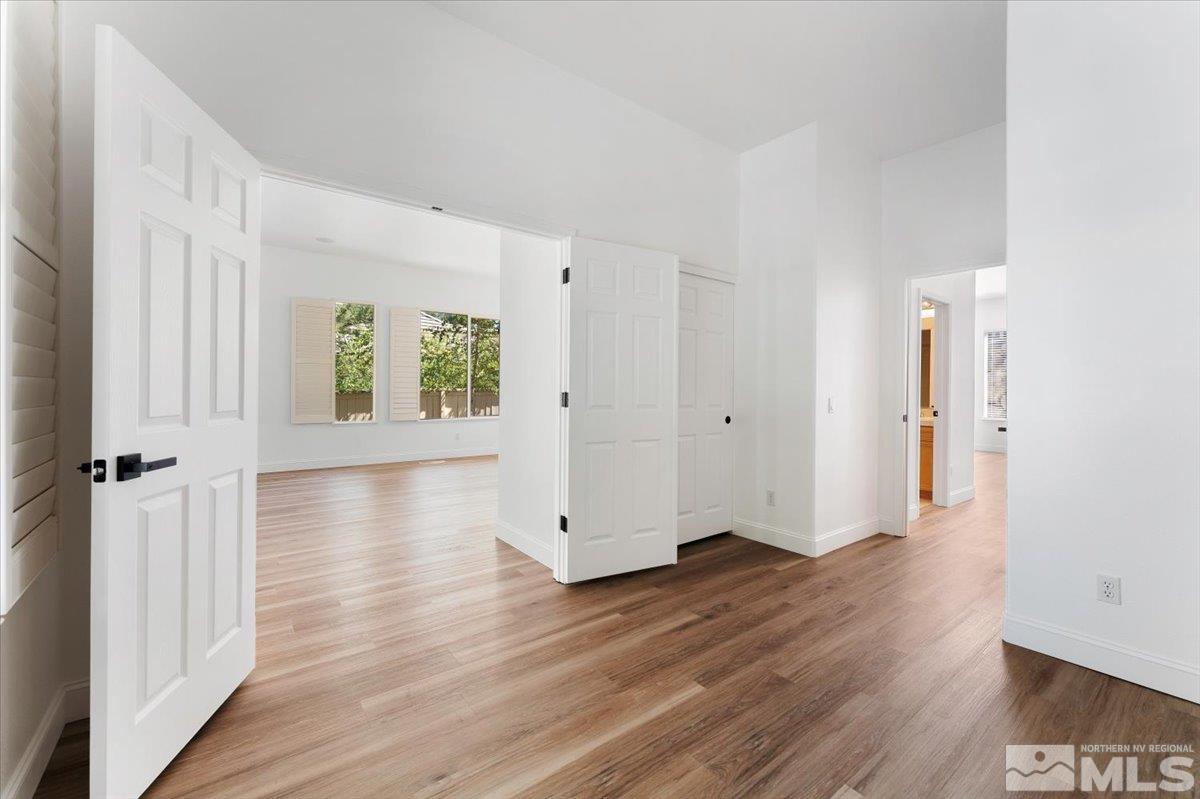 1730 Hunter Creek Road Reno, NV 89519 - Photo 23 of 39 an empty room with wooden floor and windows