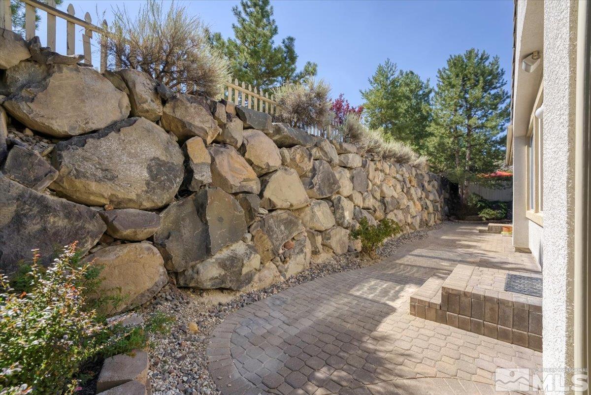 1730 Hunter Creek Road Reno, NV 89519 - Photo 27 of 39 a view of a backyard with large trees and plants