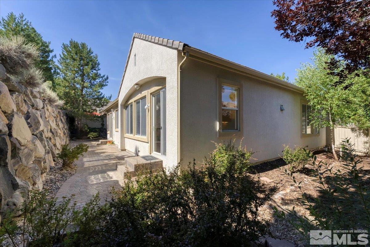 1730 Hunter Creek Road Reno, NV 89519 - Photo 28 of 39 a backyard of a house with plants and trees