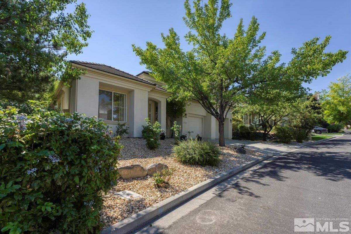 1730 Hunter Creek Road Reno, NV 89519 - Photo 3 of 39 a front view of a house with garden