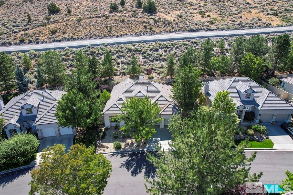 1730 Hunter Creek Road Reno, NV 89519 - Photo 32 of 39 an aerial view of a house with swimming pool and garden