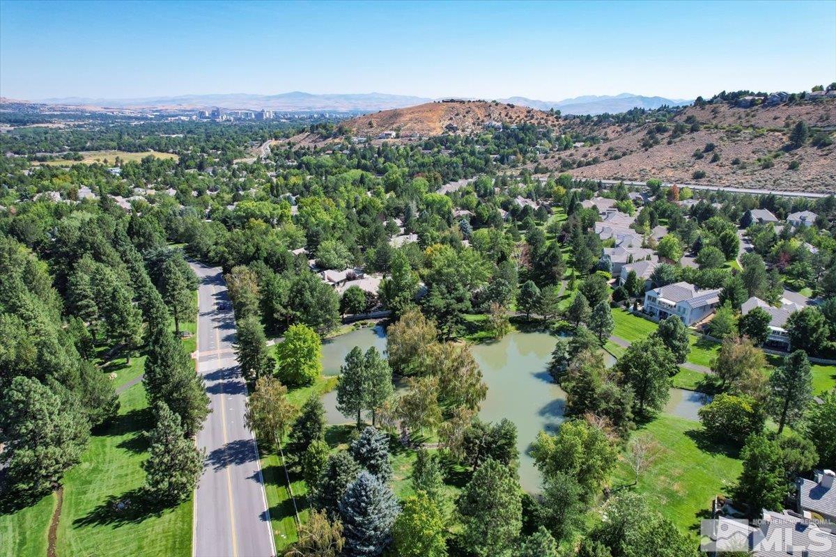 1730 Hunter Creek Road Reno, NV 89519 - Photo 34 of 39 an aerial view of a houses with a lush green hillside