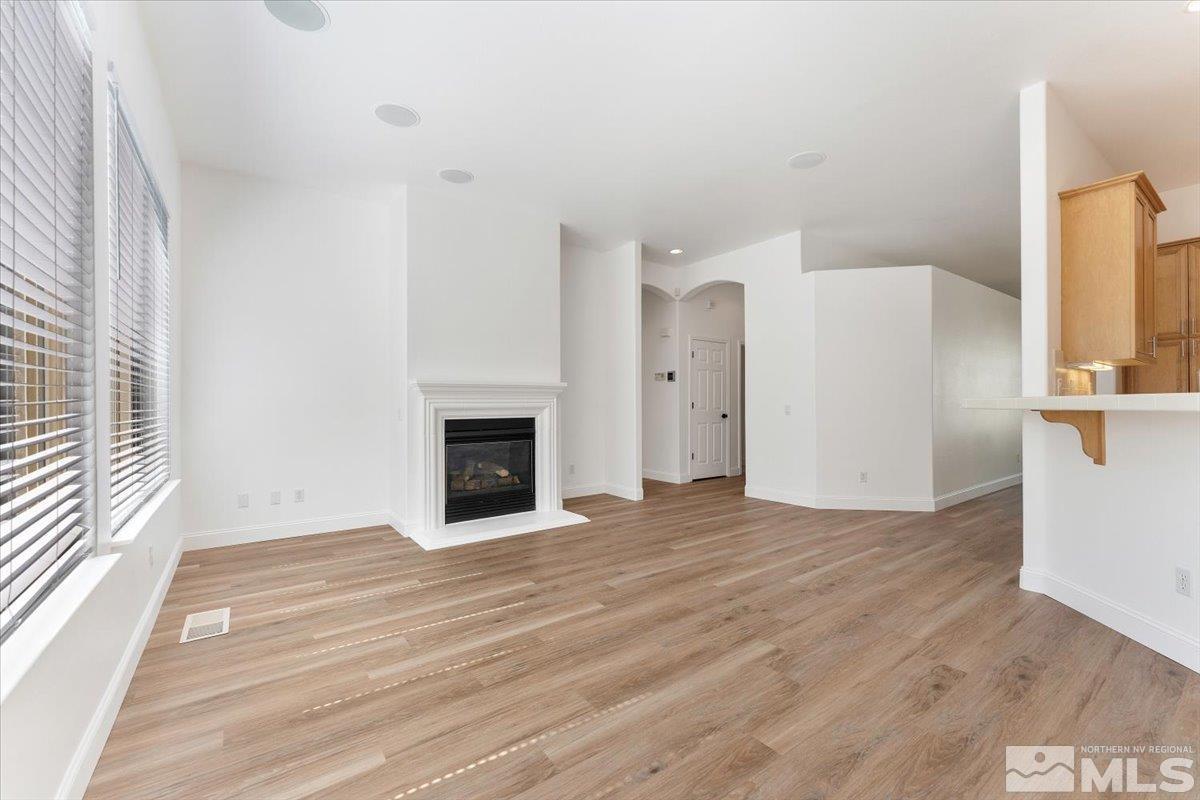1730 Hunter Creek Road Reno, NV 89519 - Photo 10 of 39 a view of a livingroom with wooden floor and a fireplace