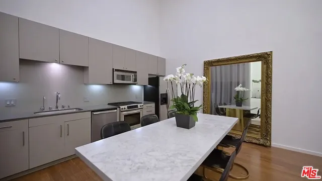 a kitchen with a table and chairs in it