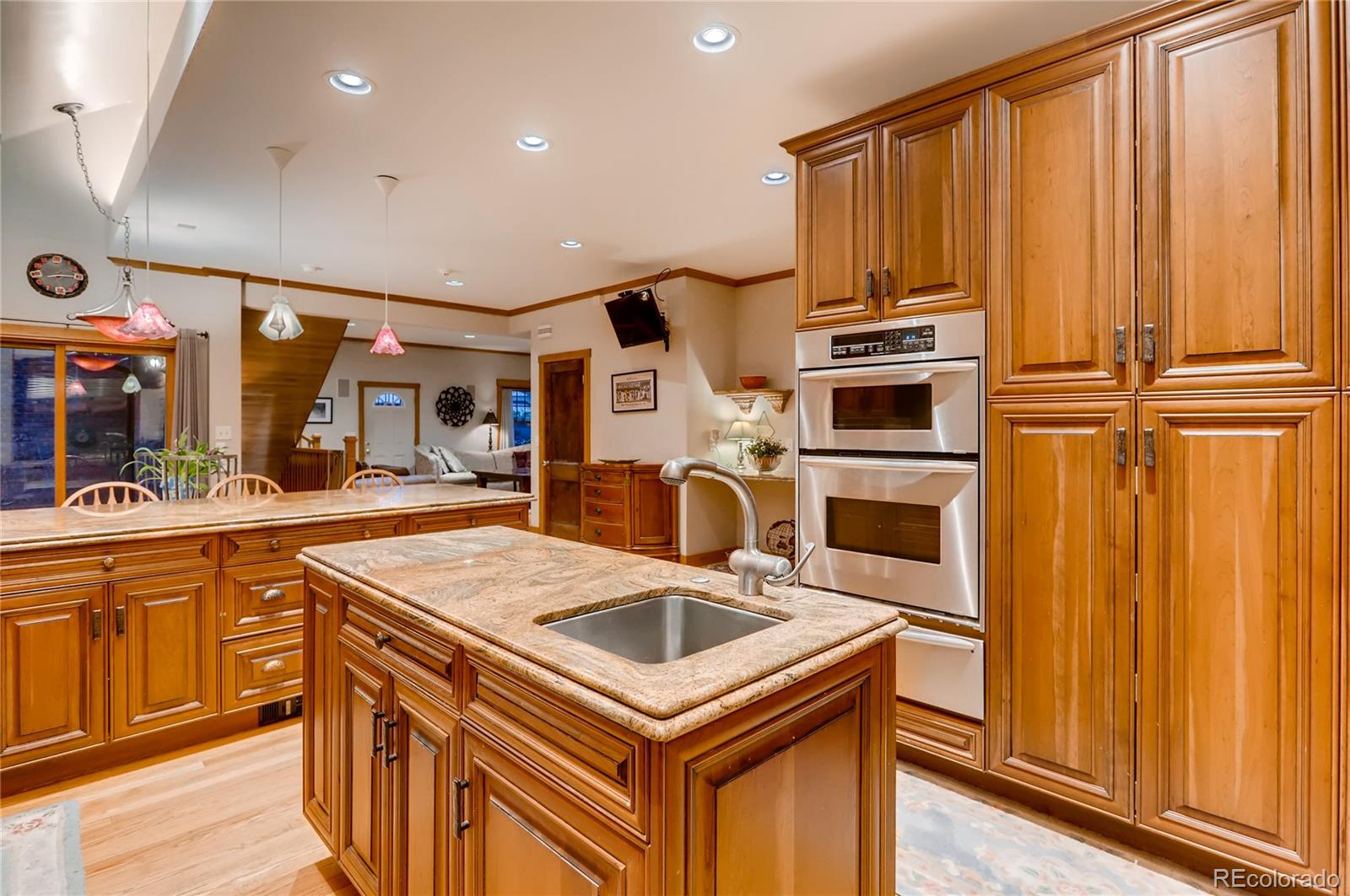 626 Fillmore Street Denver, CO 80206 - Photo 11 of 31 a kitchen that has a sink and a stove in it