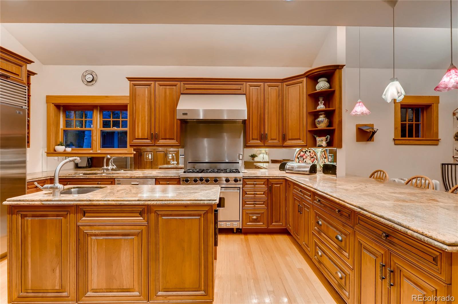 626 Fillmore Street Denver, CO 80206 - Photo 12 of 31 a kitchen with stainless steel appliances granite countertop a sink and cabinets
