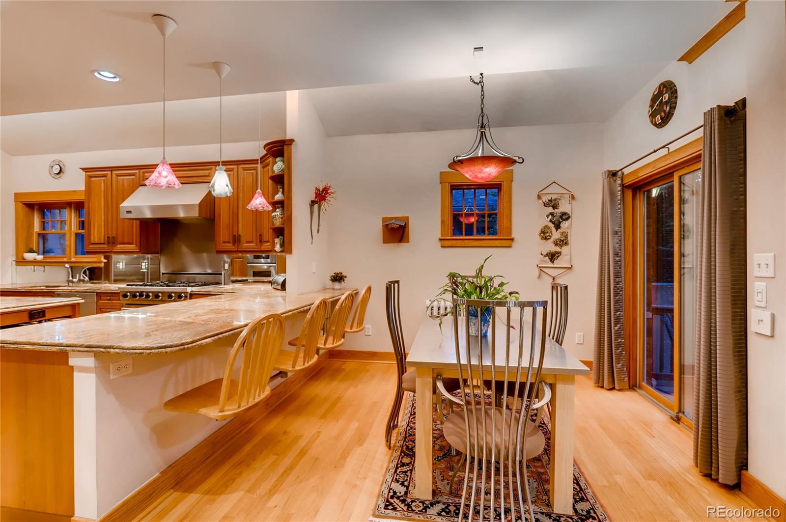 626 Fillmore Street Denver, CO 80206 - Photo 13 of 31 a dining hall with stainless steel appliances kitchen island granite countertop a table and chairs