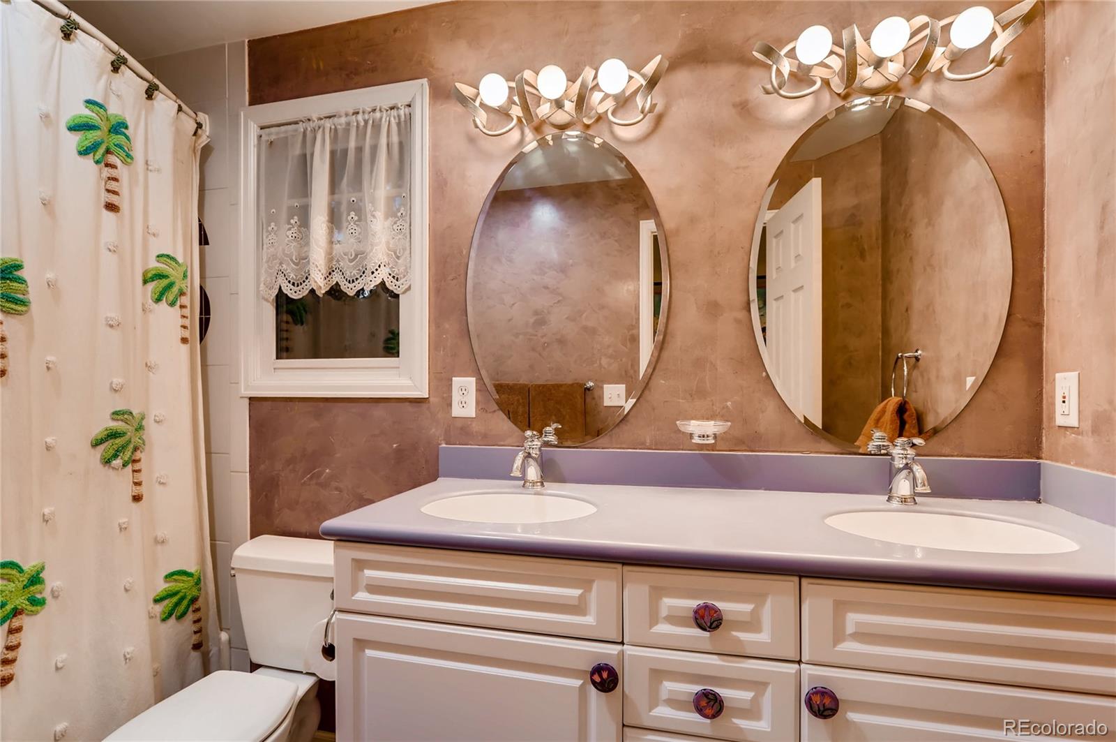 626 Fillmore Street Denver, CO 80206 - Photo 20 of 31 a bathroom with a double vanity sink and a mirror