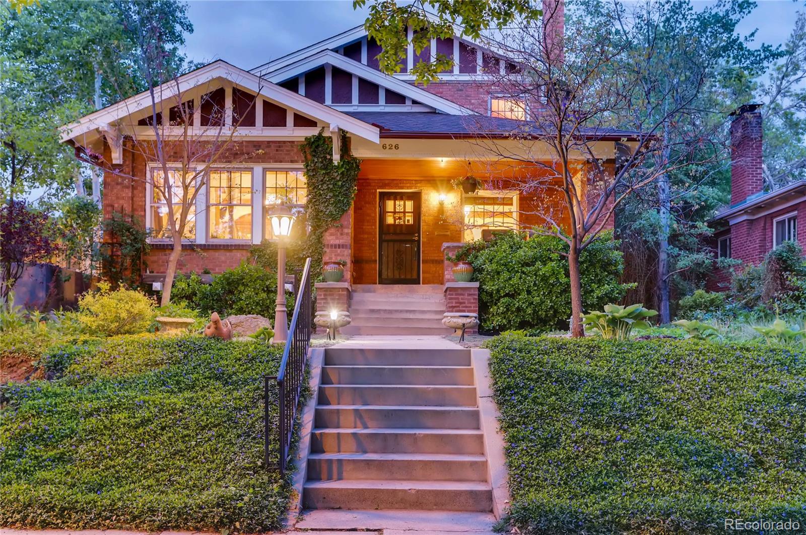 626 Fillmore Street Denver, CO 80206 - Photo 2 of 31 a front view of a house with a yard