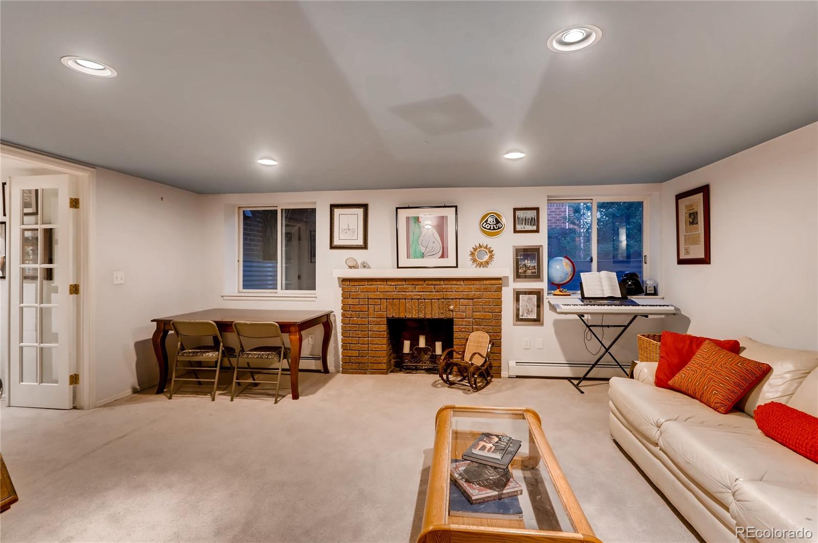 626 Fillmore Street Denver, CO 80206 - Photo 21 of 31 a living room with furniture and a fireplace