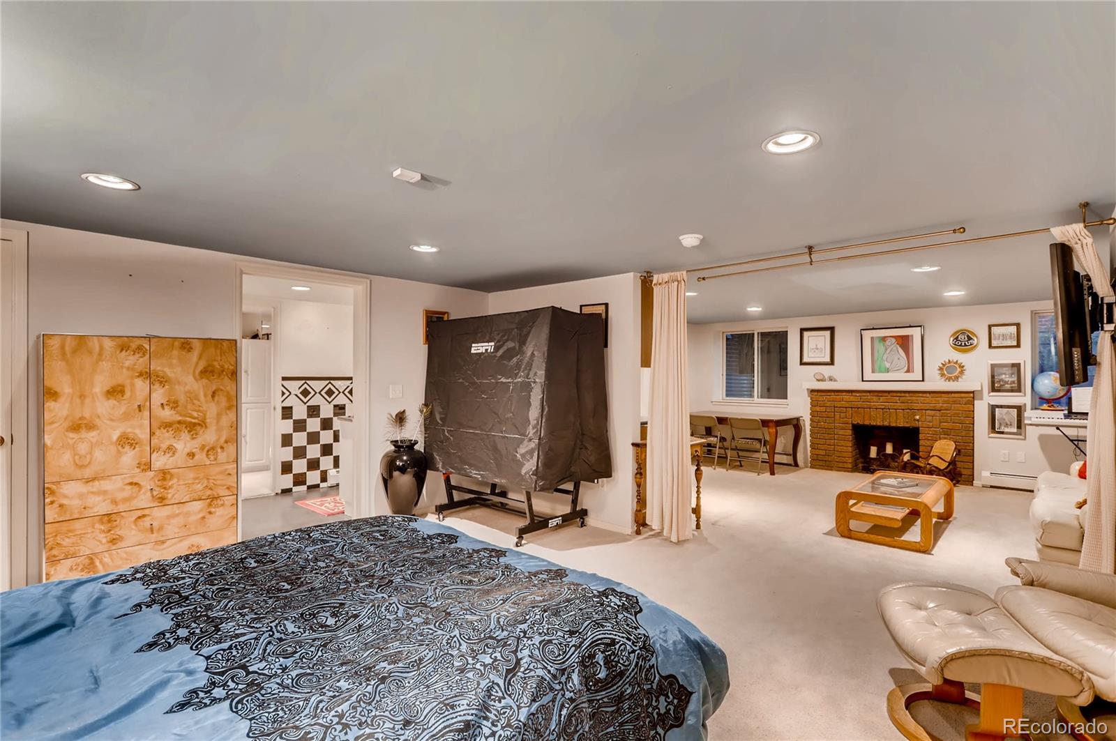 626 Fillmore Street Denver, CO 80206 - Photo 23 of 31 a spacious bedroom with a bed and furniture