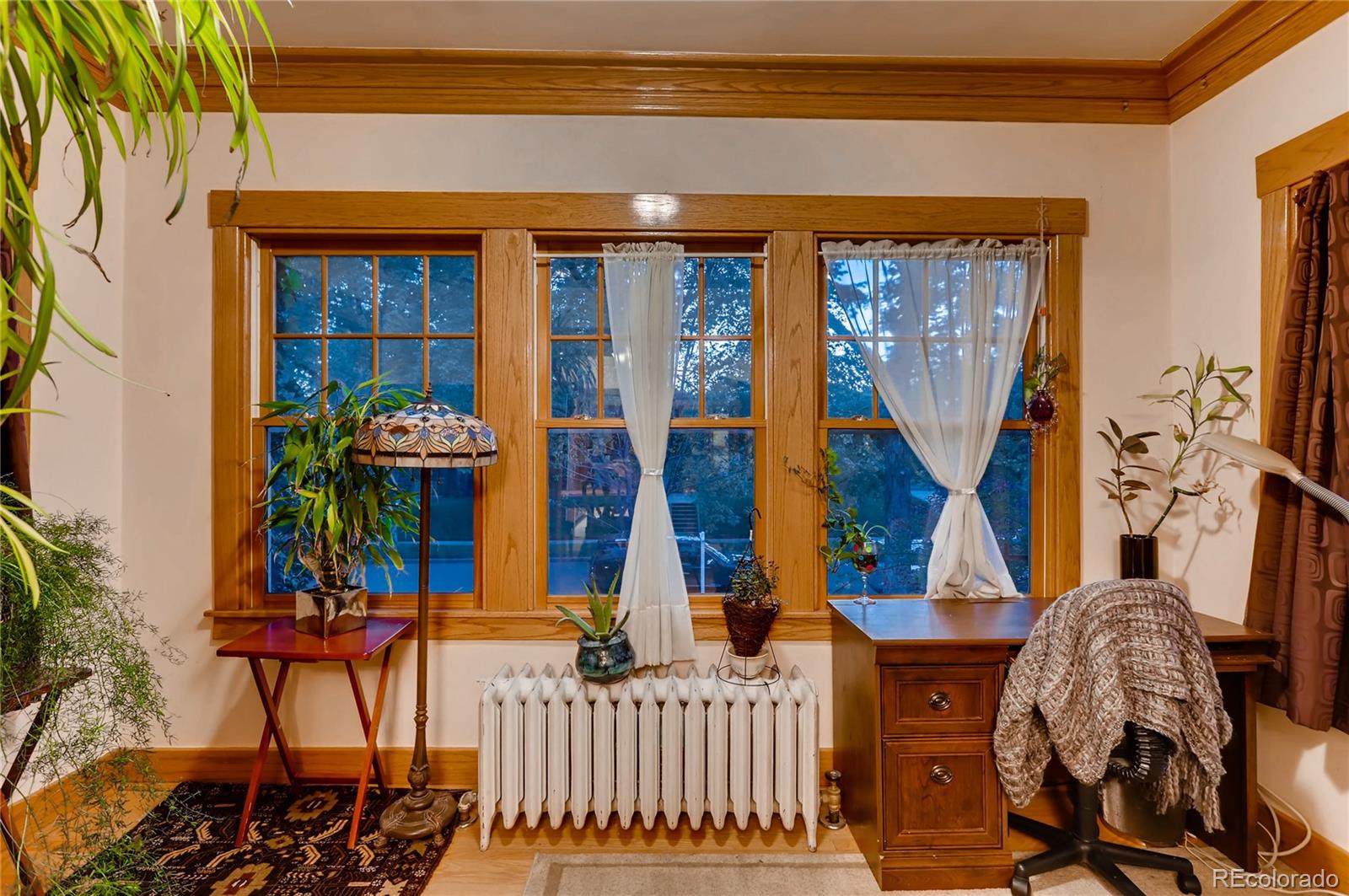 626 Fillmore Street Denver, CO 80206 - Photo 25 of 31 a view of front door of house with outdoor seating