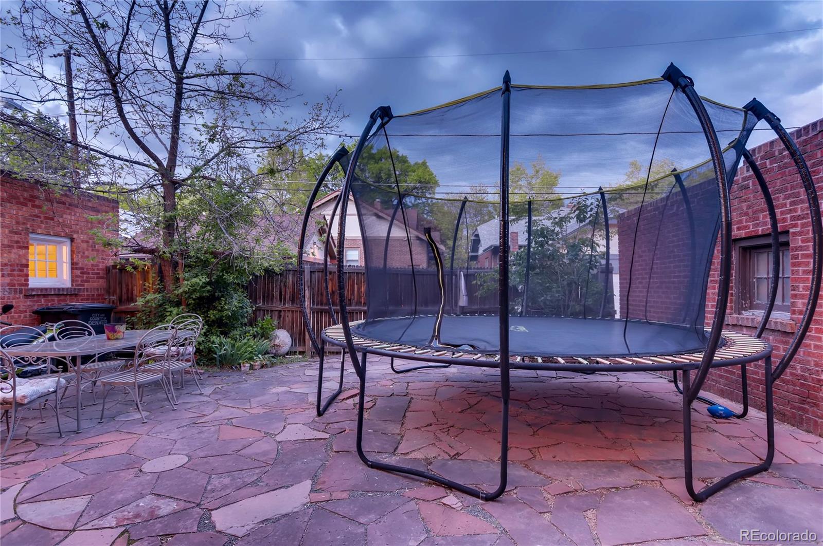 626 Fillmore Street Denver, CO 80206 - Photo 26 of 31 a patio with table and chairs