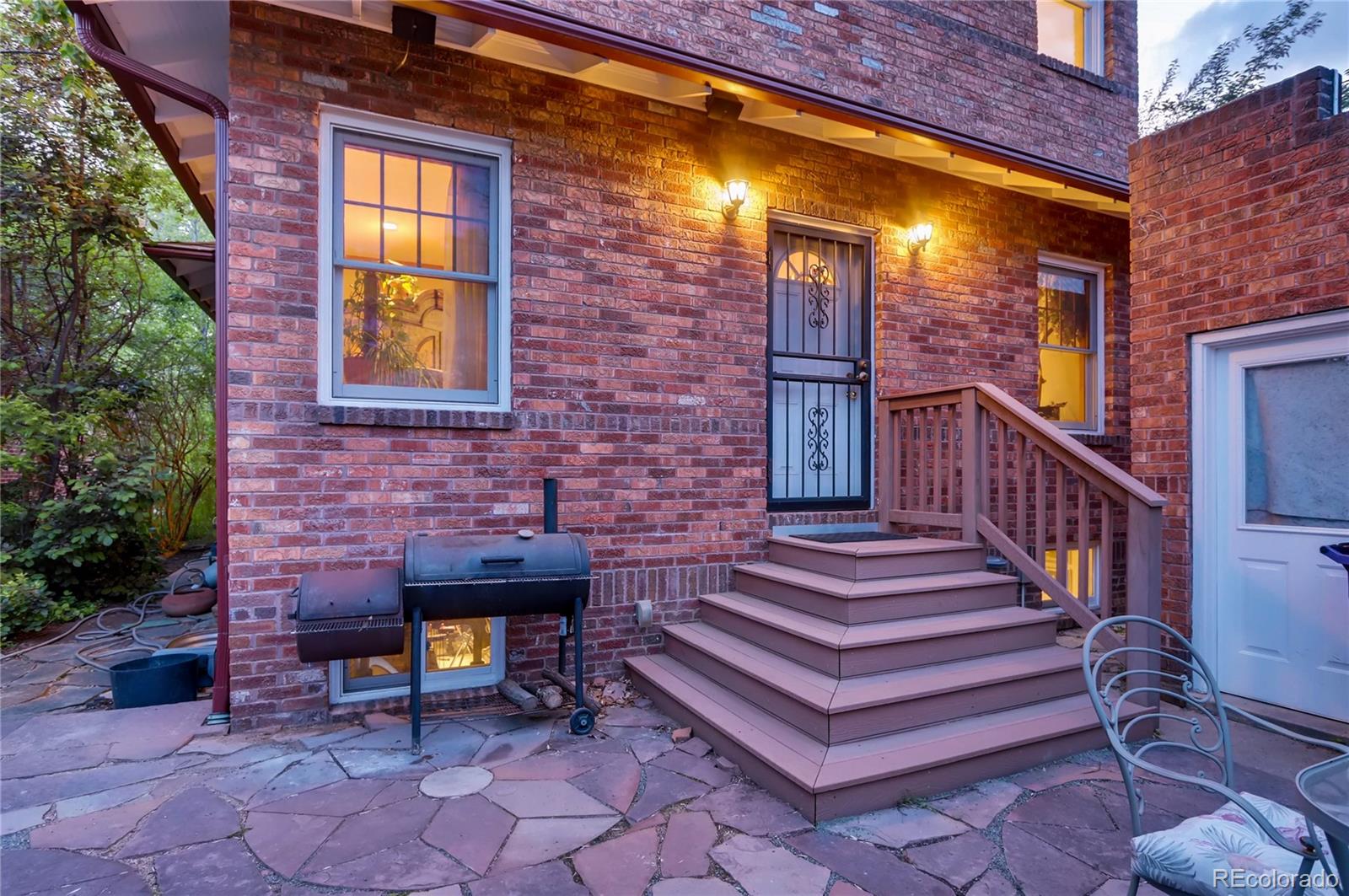 626 Fillmore Street Denver, CO 80206 - Photo 27 of 31 a view of a brick building with a bench in balcony