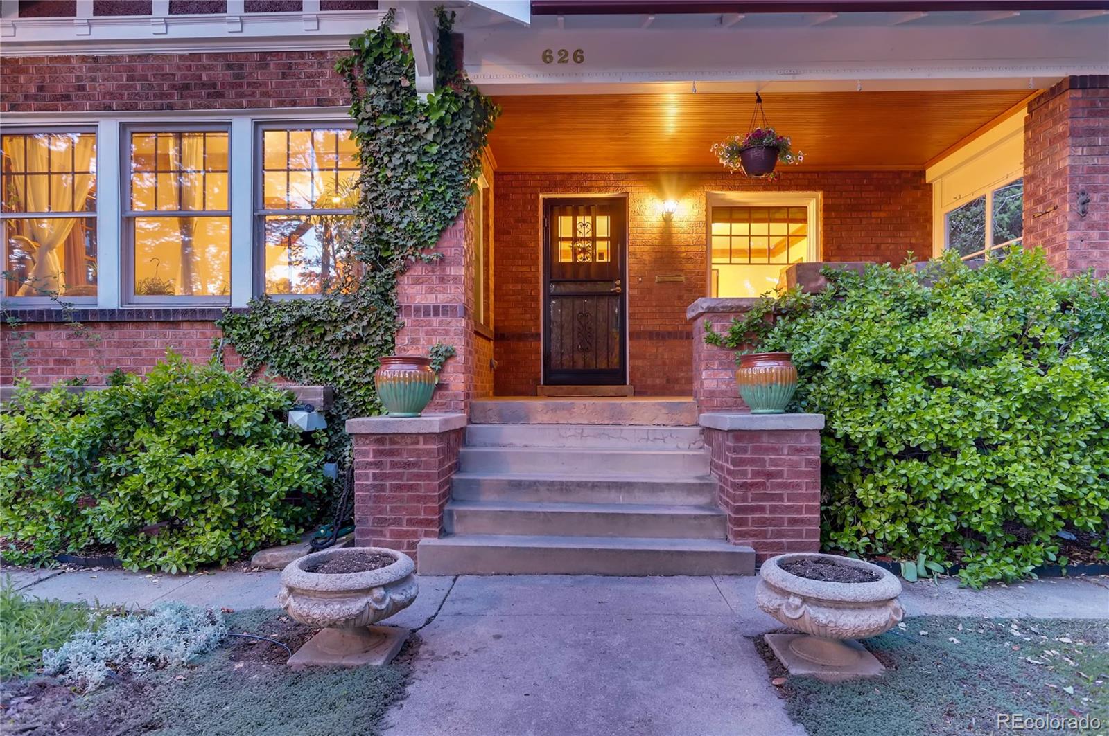 626 Fillmore Street Denver, CO 80206 - Photo 3 of 31 a front view of a house with a yard