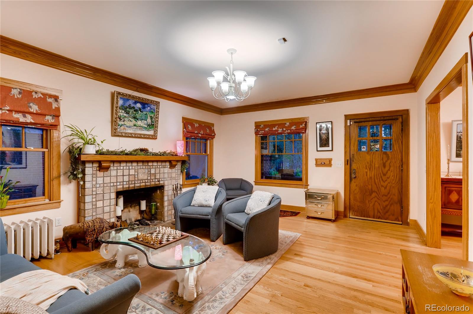 626 Fillmore Street Denver, CO 80206 - Photo 6 of 31 a living room with furniture and a fireplace