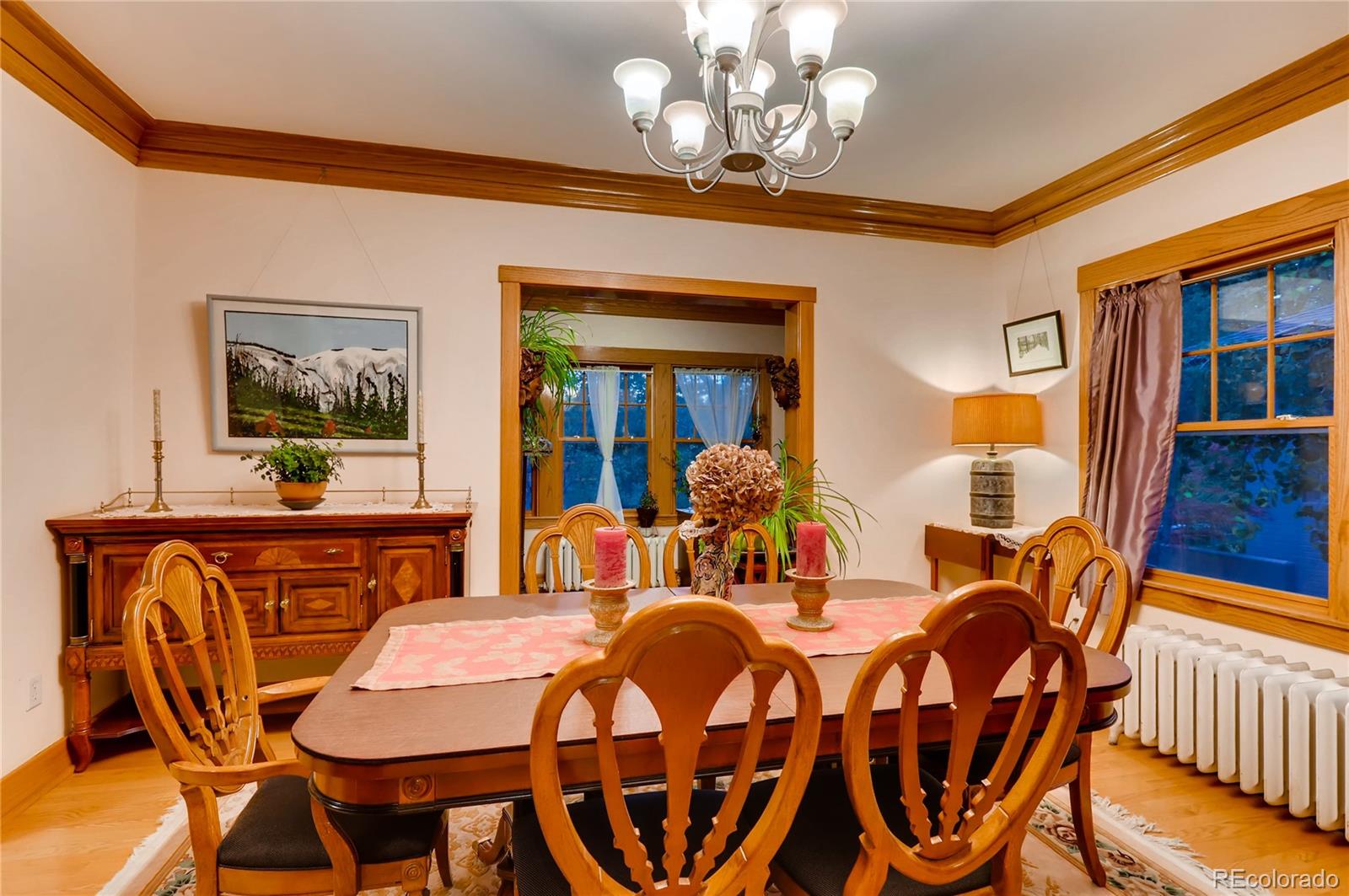 626 Fillmore Street Denver, CO 80206 - Photo 7 of 31 a view of a dining room with furniture wooden floor and chandelier