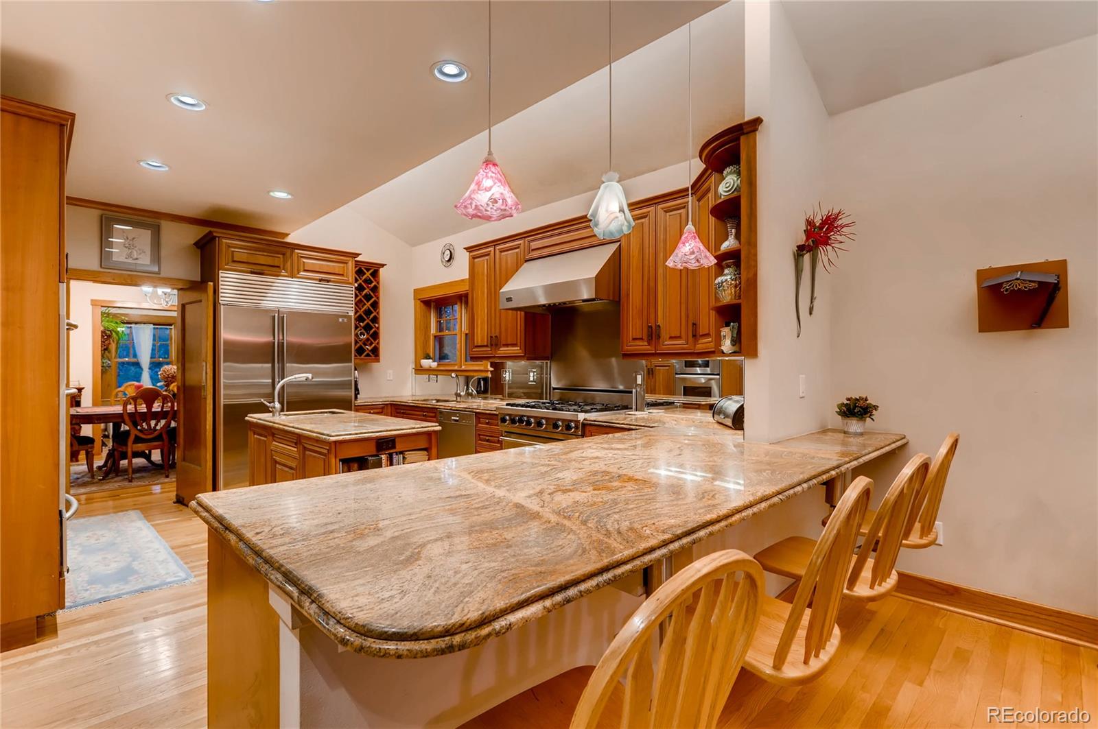 626 Fillmore Street Denver, CO 80206 - Photo 9 of 31 a kitchen with stainless steel appliances granite countertop a sink and counter space