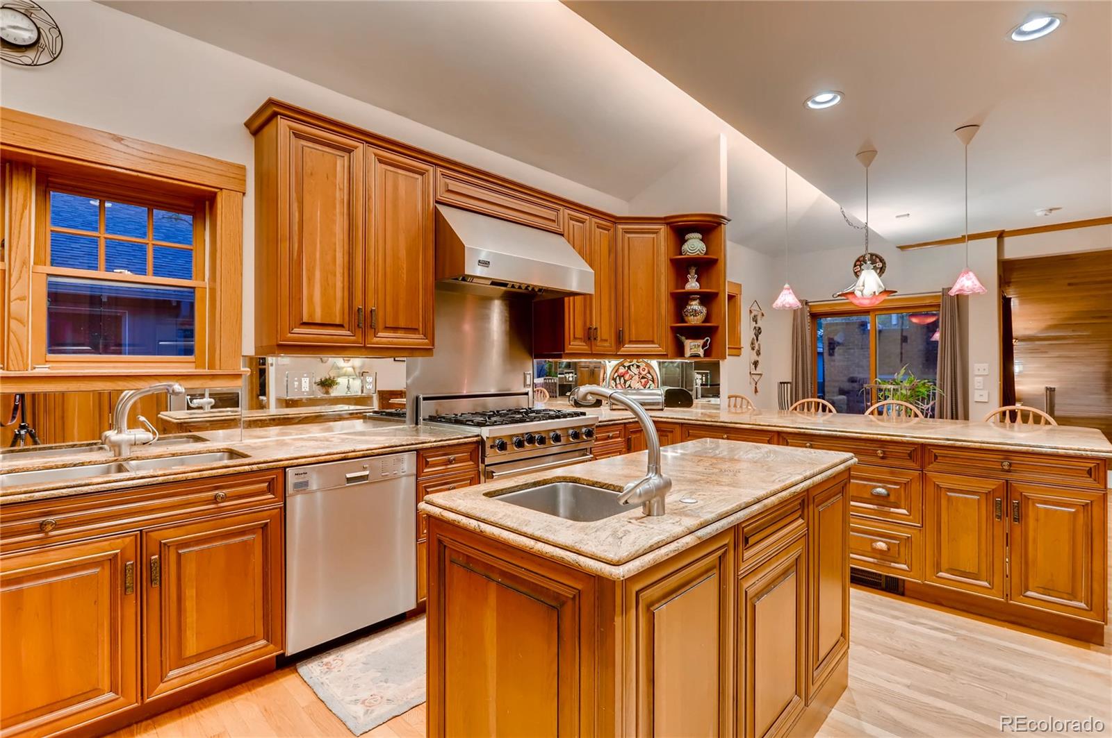 626 Fillmore Street Denver, CO 80206 - Photo 10 of 31 a kitchen with stainless steel appliances granite countertop a sink stove and cabinets