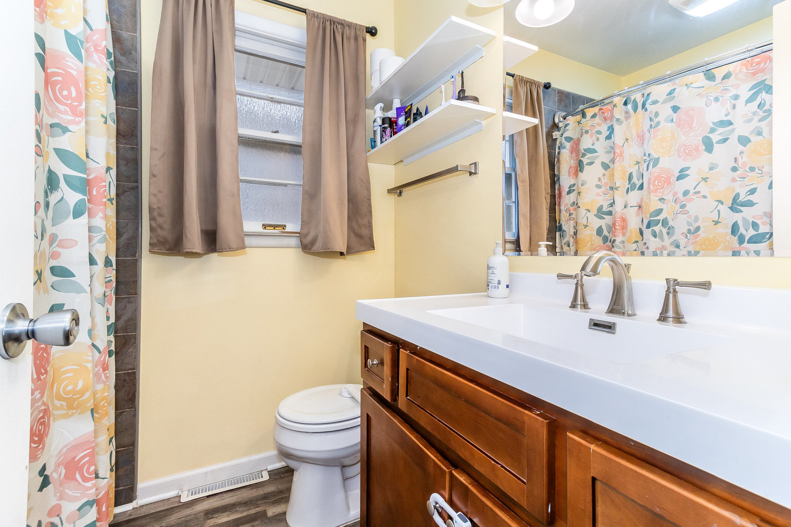 14 South Reed Street Joliet, IL 60436 - Photo 8 of 15 a bathroom with a sink a toilet and a mirror