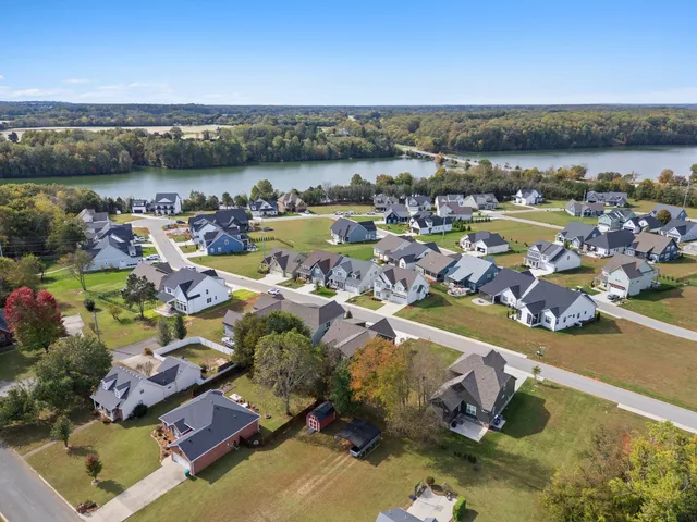 an aerial view of a city with lake view