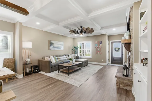 a living room with a fireplace and a flat screen tv