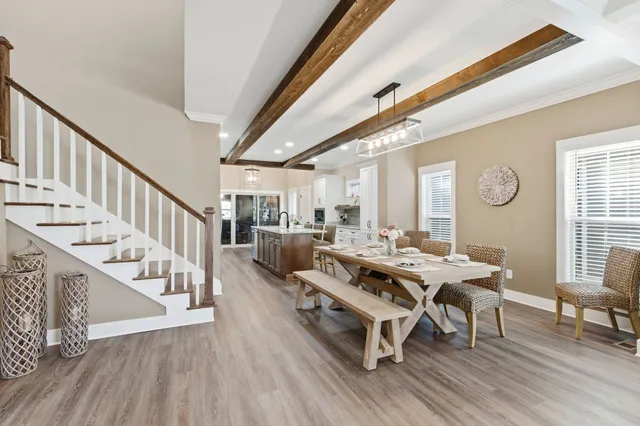 a very nice looking hallway with a chair