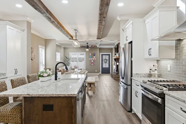 a view of kitchen with granite countertop cabinets and wooden floor