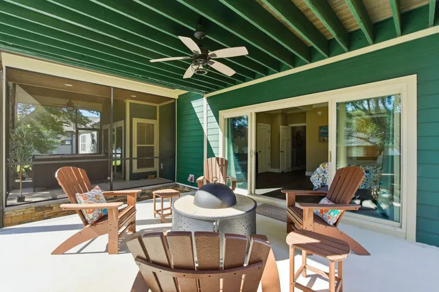 a view of a livingroom with workspace and a window