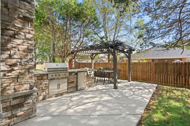an outdoor space with patio and outdoor seating